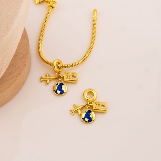 Charm viajero baño 18k
