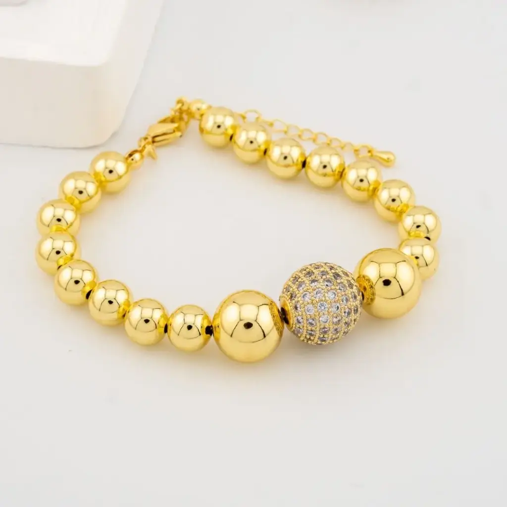 Pulsera con bola de  zirconias  baño 18k