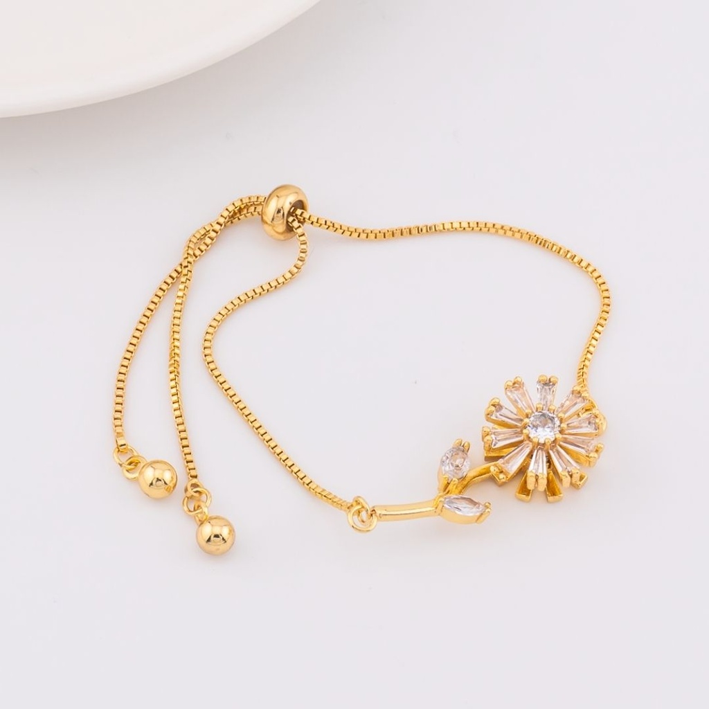 pulsera ajustable con flor giratoria baño 18k