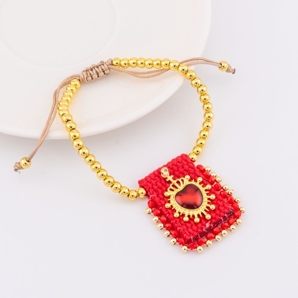 Pulsera ajustable con escapulario tejido a mano con  baño 18k