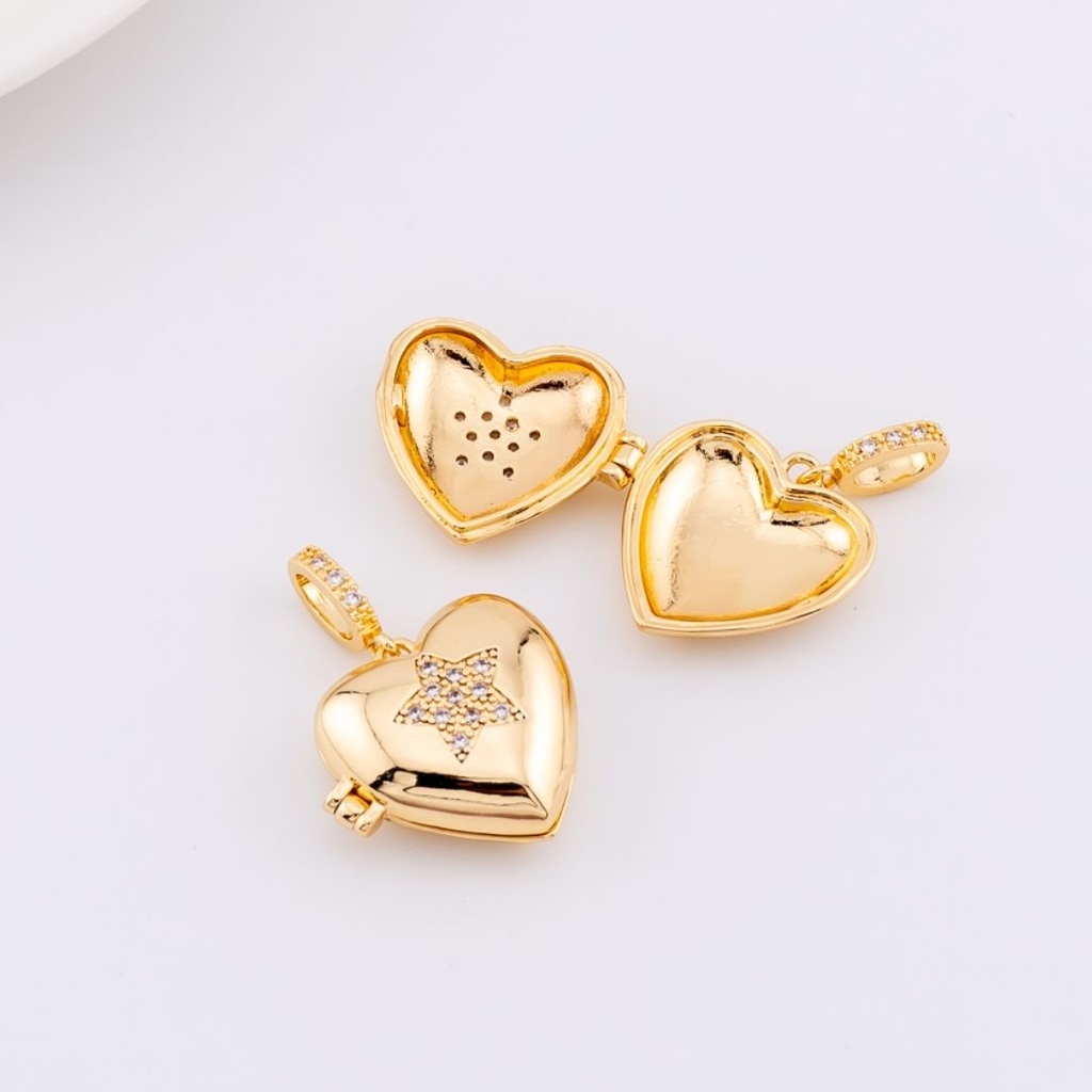 Dije Relicario corazón estrella  micropave Baño 18k