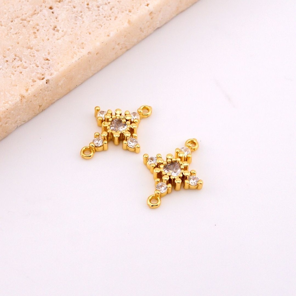 Enlace en forma de cruz micropave y baño 18k