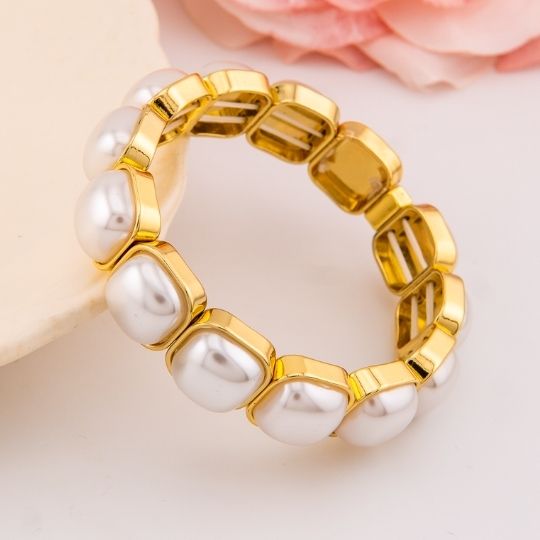 Pulsera elastica con perlas baño 18k