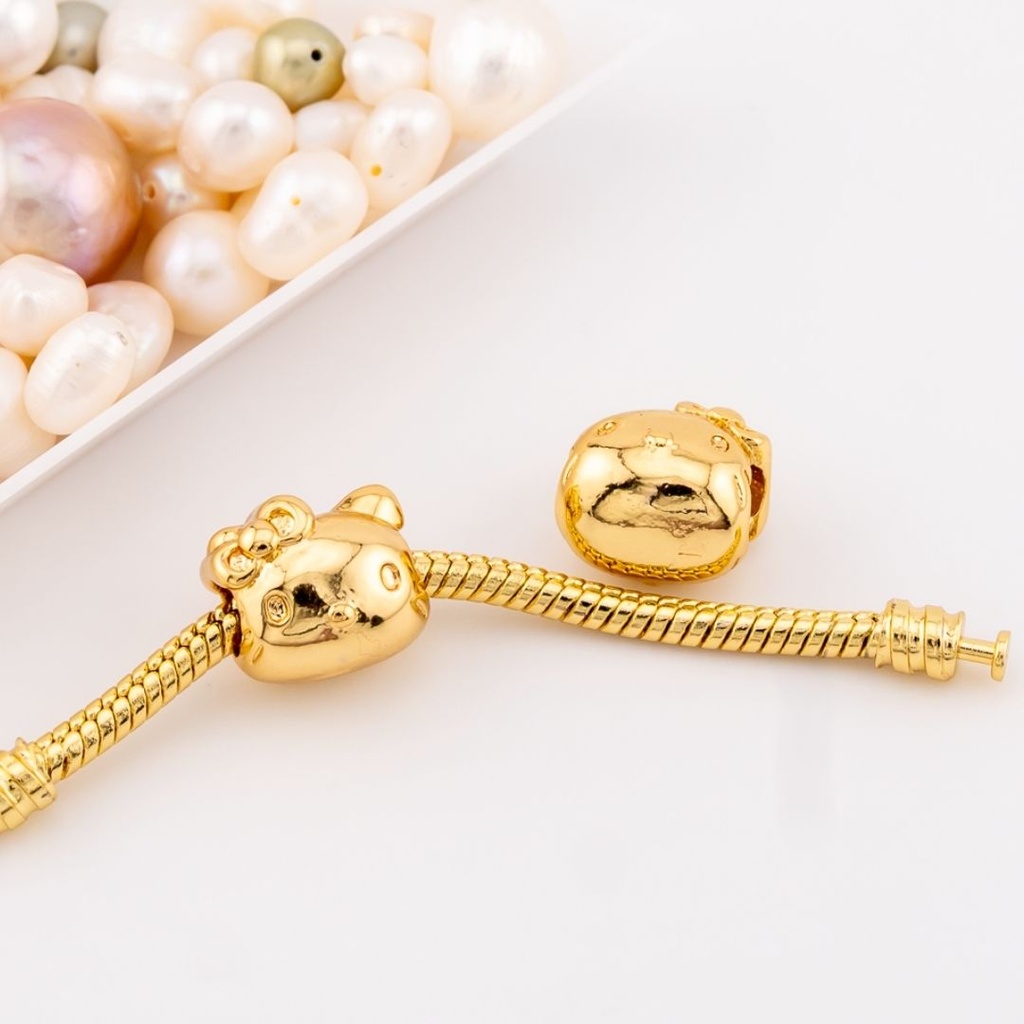 Dije estilo charm pandora  hello kitty baño 18k