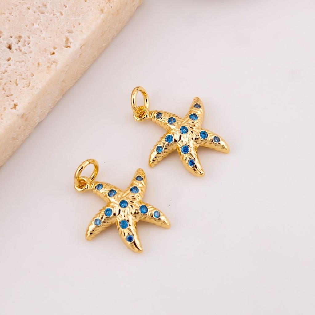 Dije mini estrella de mar micropave con baño 18k