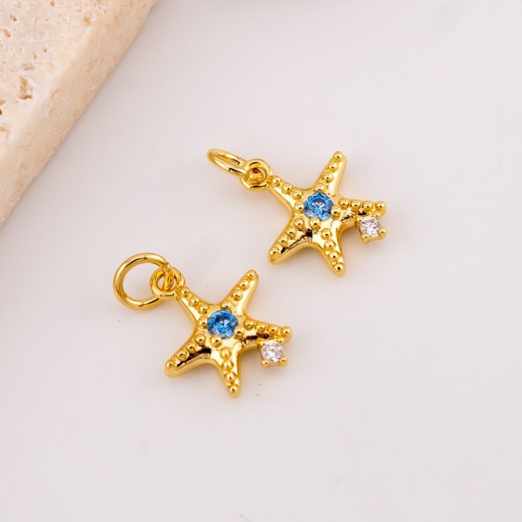 Dije mini estrella de mar micropave con baño 18k
