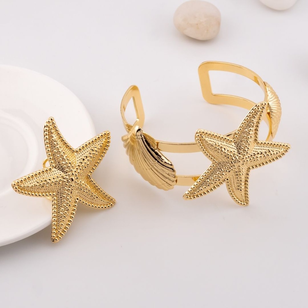 Set de anillo y brazalete estrella y concha de mar baño 18k