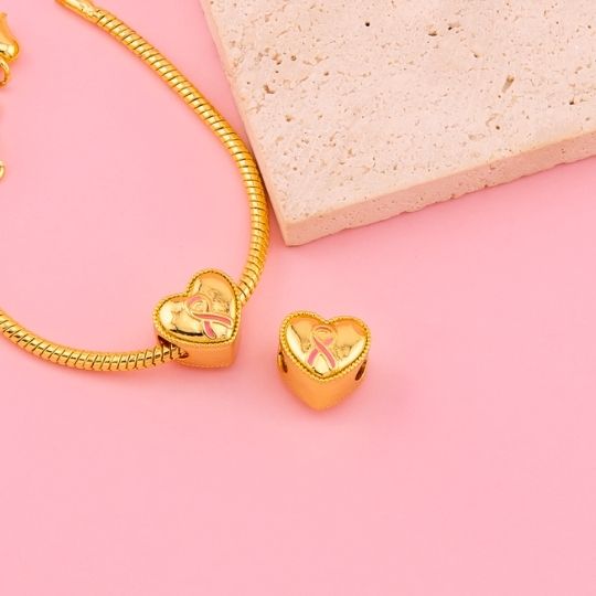 Charm corazon lazo rosado cancer de mama baño 18k
