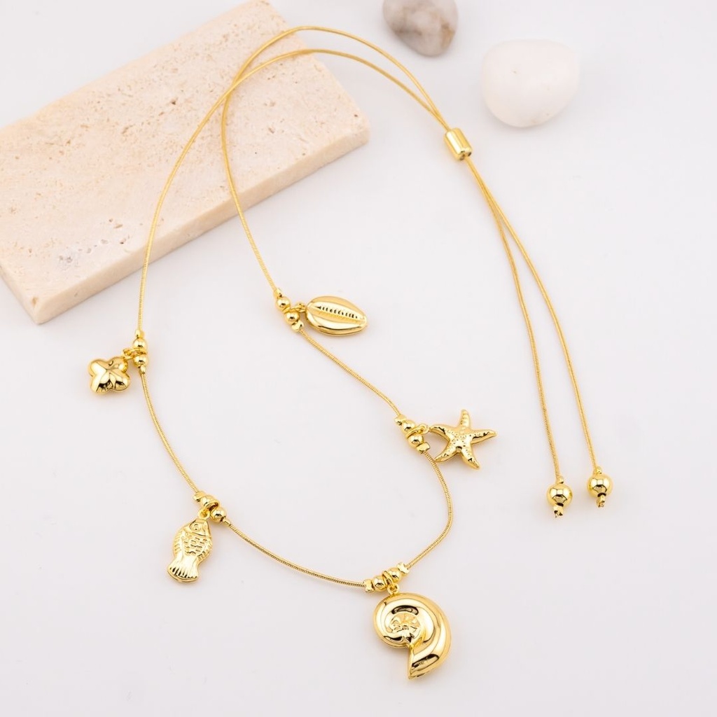 Collar ajustable con dijes marinos estrella, caracol y concha de mar  baño 18k