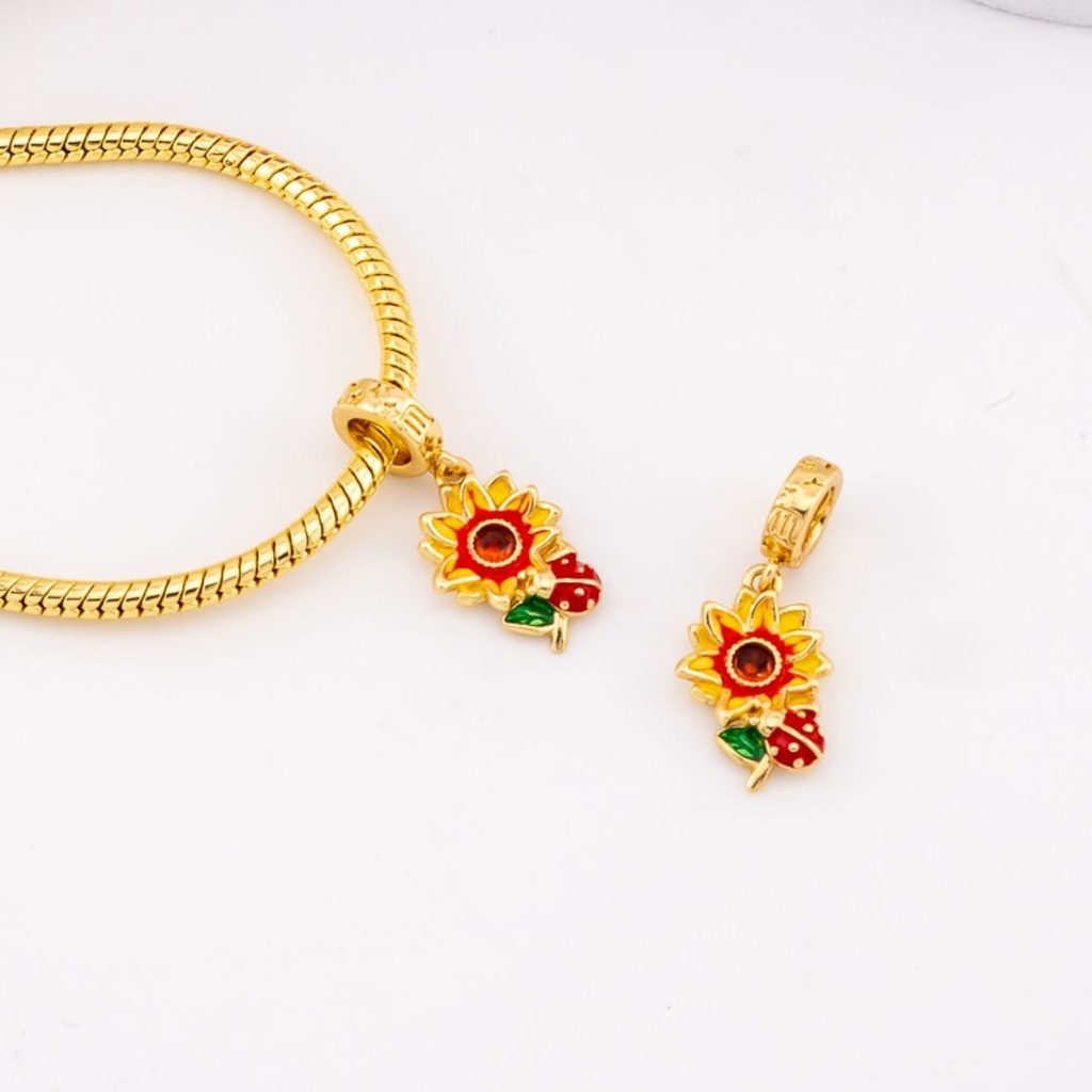 Charm de girasol baño 18k