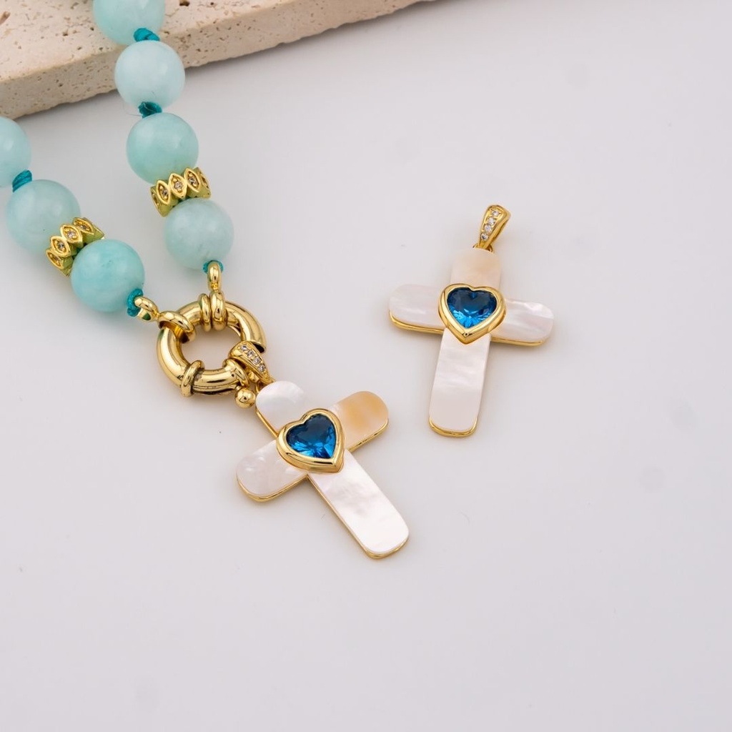 Dije cruz madre perla corazon azul baño 18k