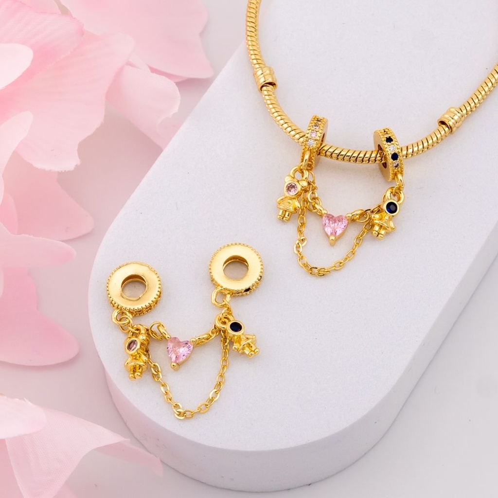 Charm pareja baño 18k