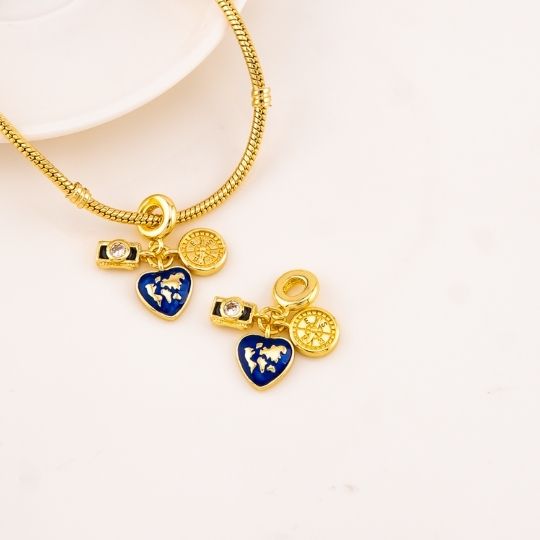 Charm viajero baño 18k