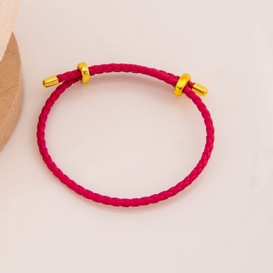 Pulsera fucsia de cuero baño 18k