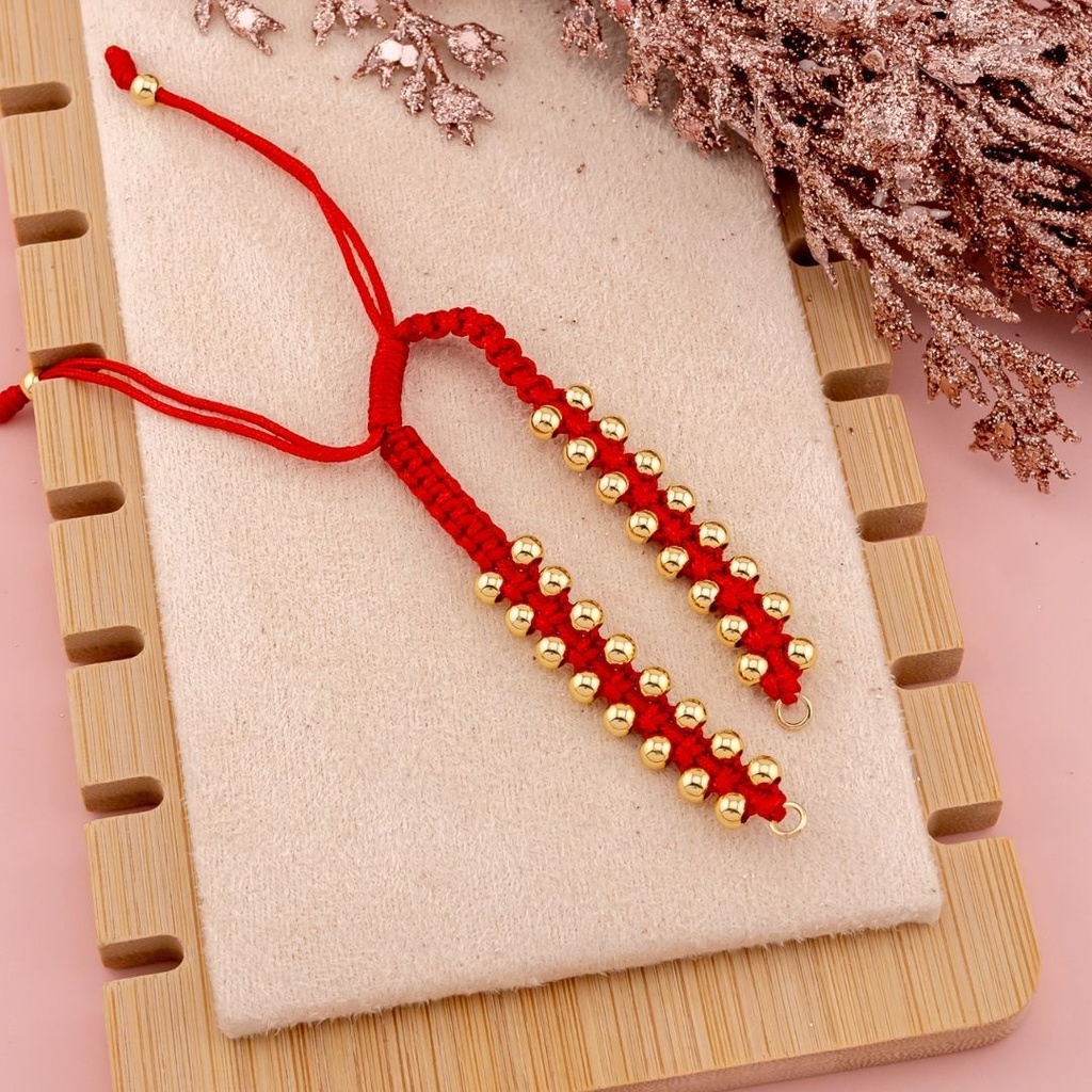 Pulsera ajustable trenzada de hilo con balines baño 18k roja