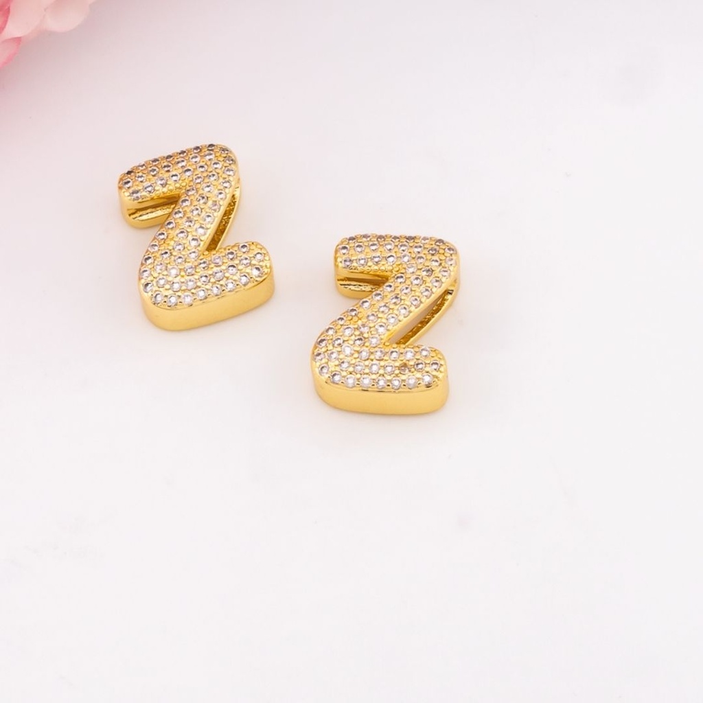 Separador de letras chunky con zirconias baño 18k