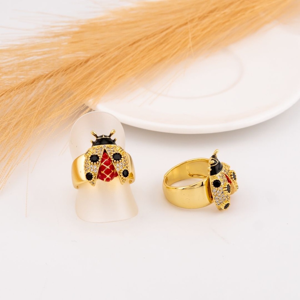 Anillo de mariquita con zirconias baño 18k