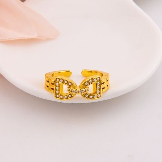 Anillo ajustable de marca con perlas baño 18k