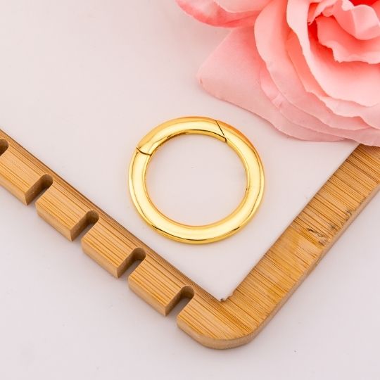 Broche redondo baño 18k