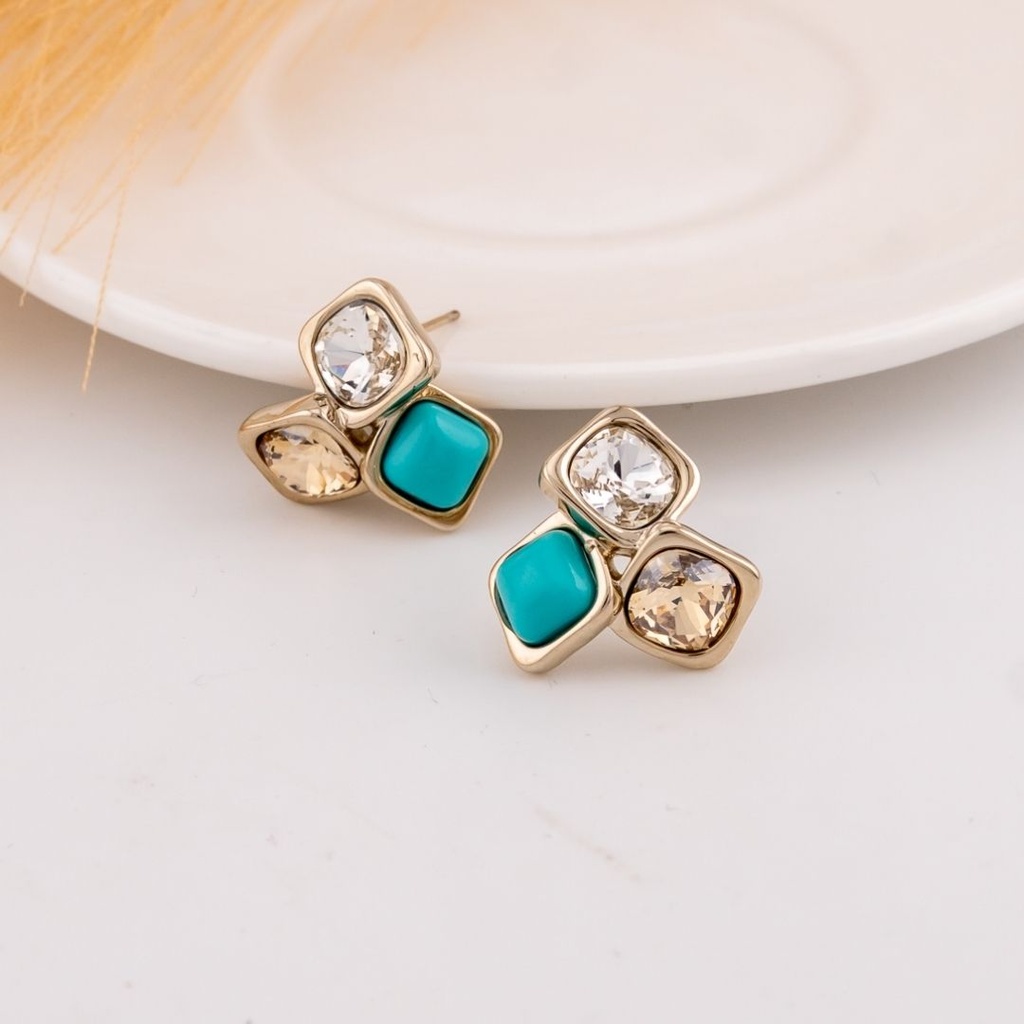 Aretes stud con turqueza y zirconias baño 18k