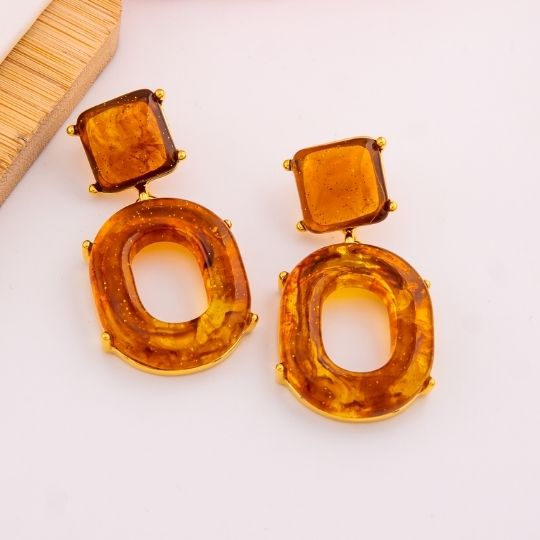 Aretes colgantes carey baño 18k