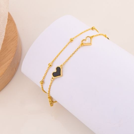 Pulsera doble de corazones baño 18k
