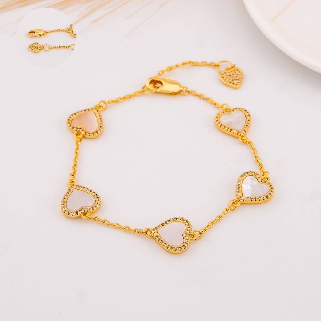 Pulsera de corazones con madre perla y zirconias baño 18k