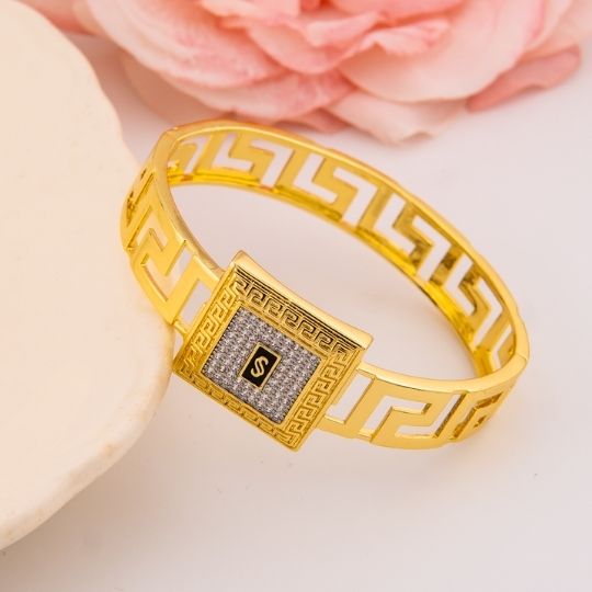 Brazalete de marca con zirconias baño 18k