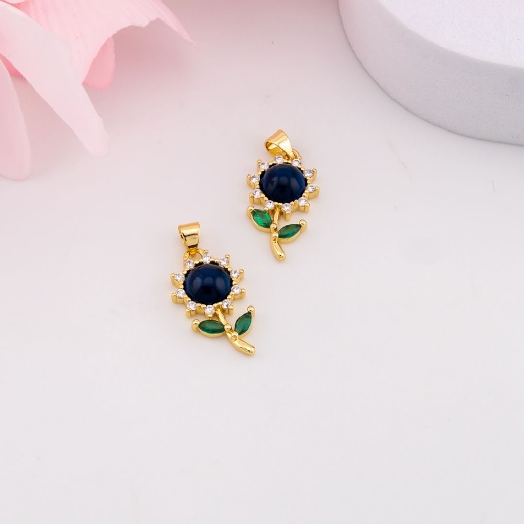 Dije de flor con zirconias baño 18k azul