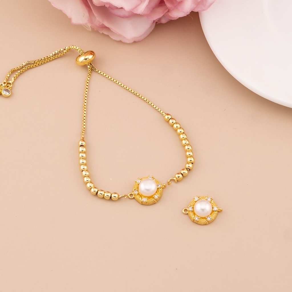 Enlace redondo con perla y zirconias baño 18k