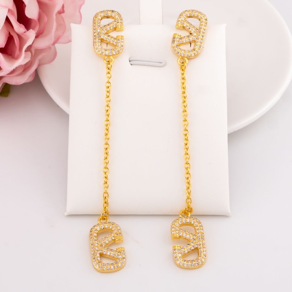 Aretes colgantes de marca con zirconias baño 18k
