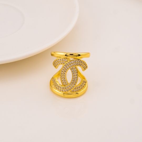 Anillo chunky de marca con zirconias baño 18k