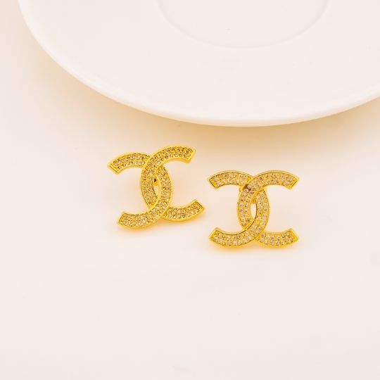 Aretes stud de marca con zirconias baño 18k