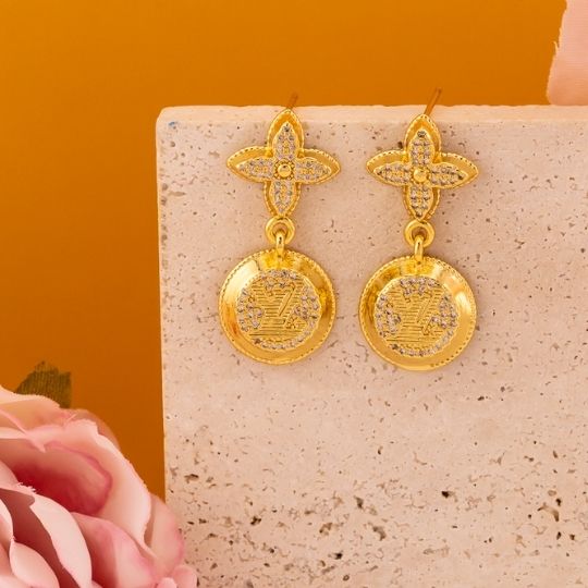 Aretes colgantes de marca con zirconias baño 18k