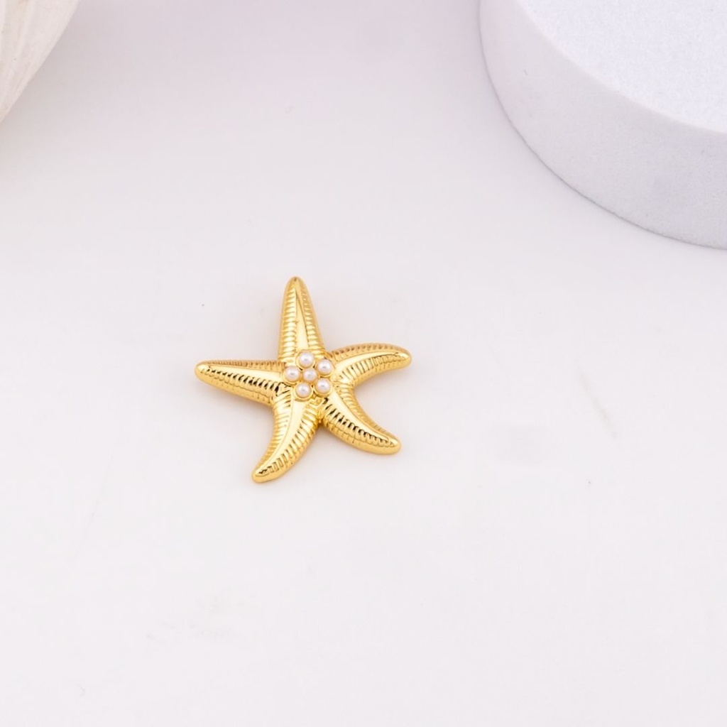 Dije estrella de mar con perlas baño 18k
