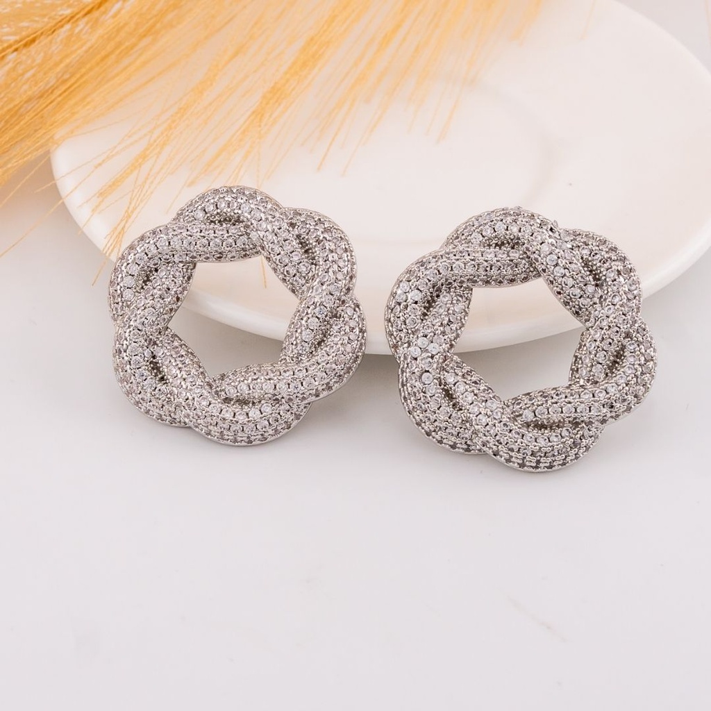 Aretes stud con zirconias baño 18k plat