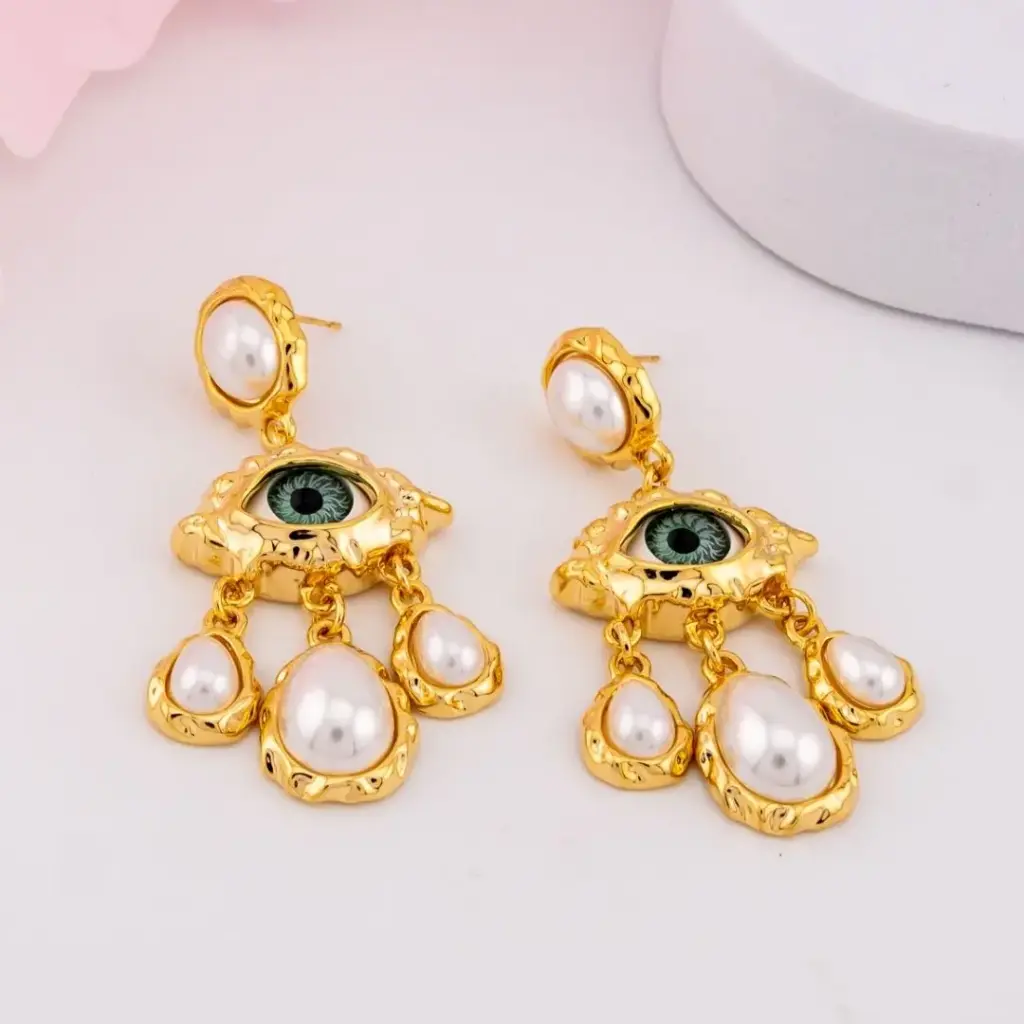 Aretes colgantes de ojos con perlas baño 18k