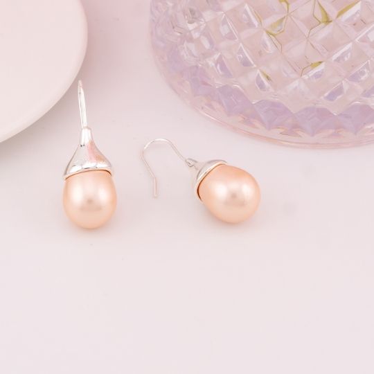 Aretes perlas shell en forma de gota baño 18k