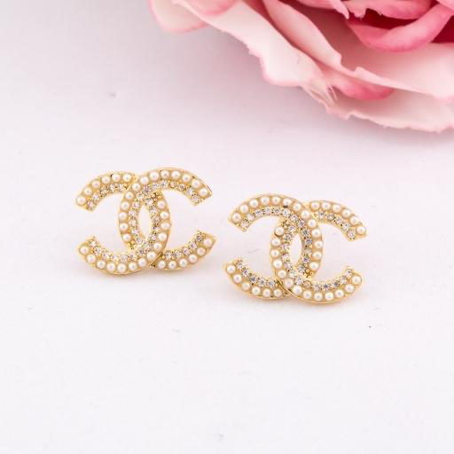 Aretes stud de marca con perlas y zirconias baño 18k