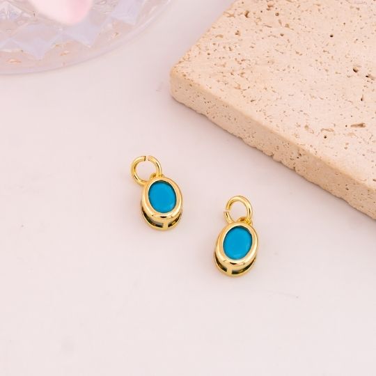 Dije ovalado con zirconia baño 18k turqueza