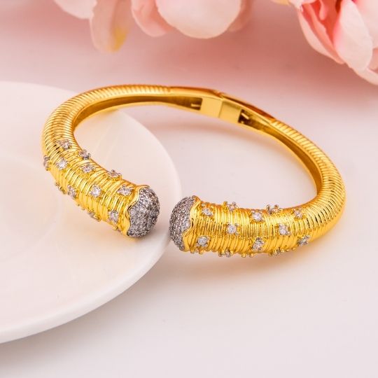 Brazalete doble tono con zirconias baño 18k