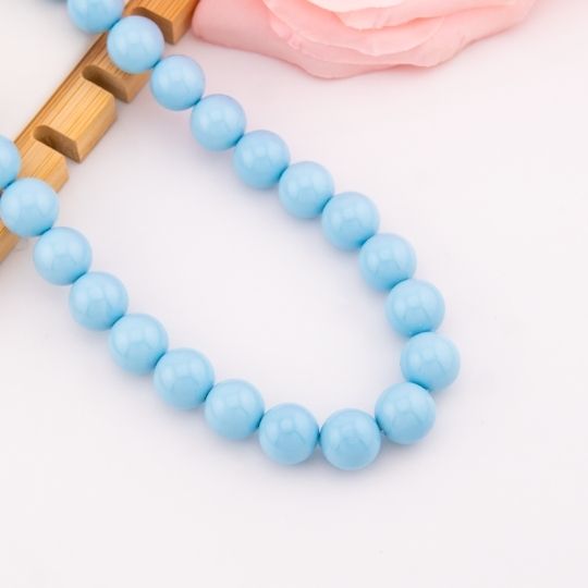 Collar bola chicle azul cielo en concha nacar baño 18k