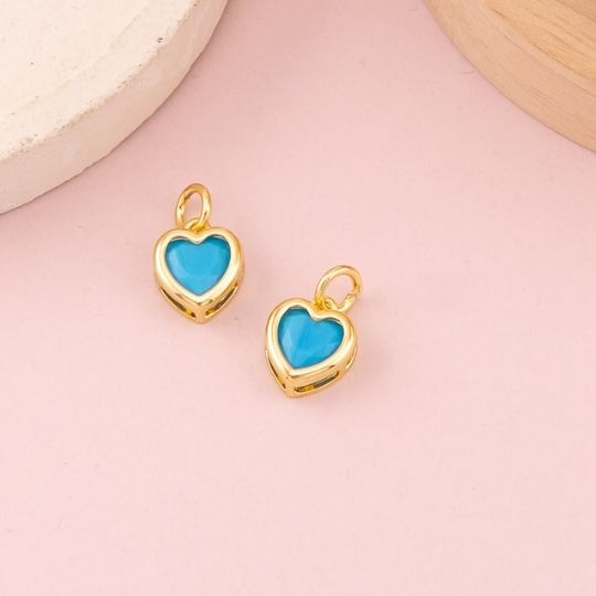 Dije de corazon con cristal baño 18k celeste