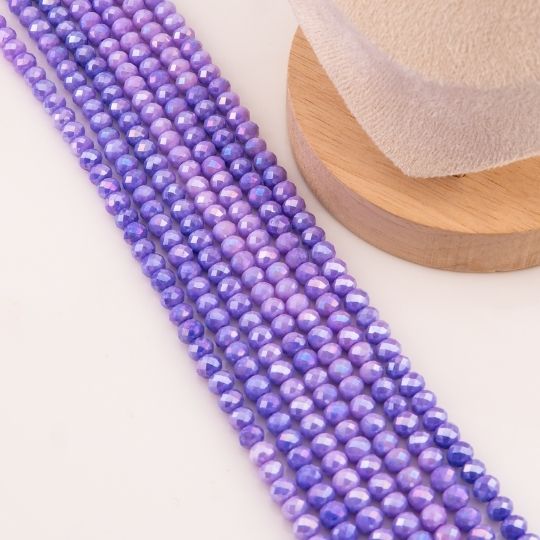 Cristal jade de 6mm facetado color morado pastel con recubrimiento Aura/AB