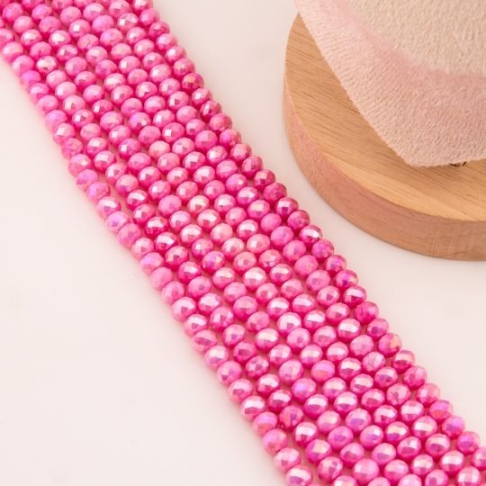 Cristal jade de 6mm facetado color rosa pastel con recubrimiento Aura/AB