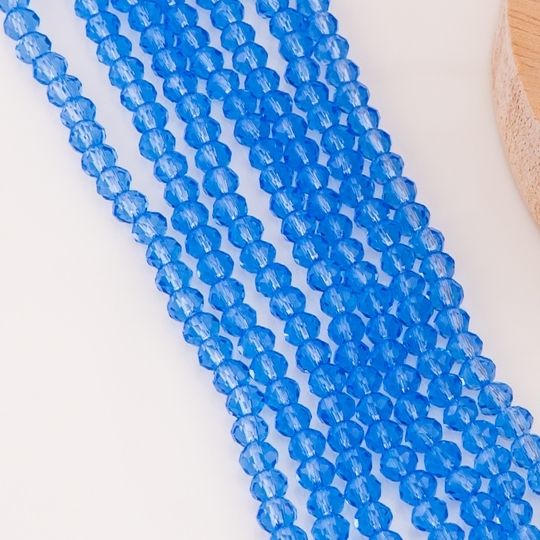 Cristal Rondelle azul zafiro transparente 6mm
