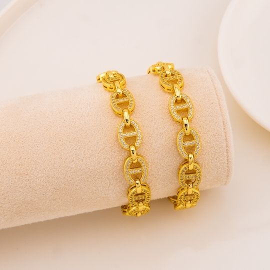 Pulsera de marca con zirconias baño 18k
