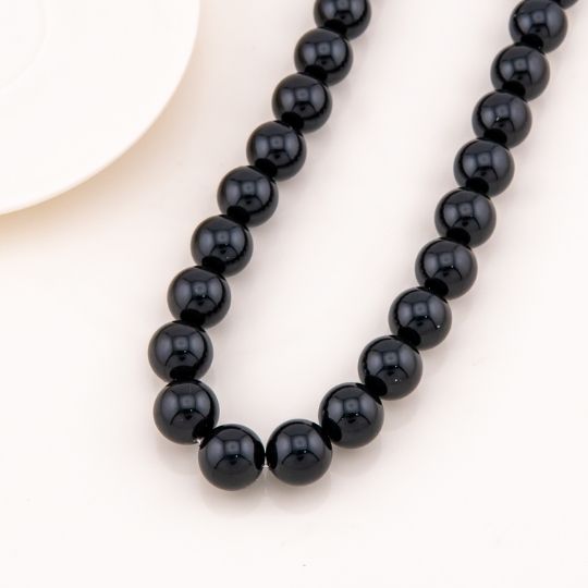 Collar bola chicle negro en concha nacar 14mm baño 18k
