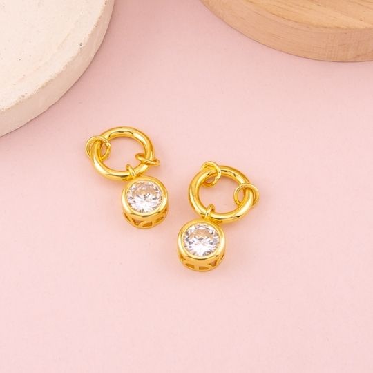 Dije redondo en cristal baño 18k