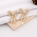 Aretes stud chongo con zirconia plata baño 18k premiun
